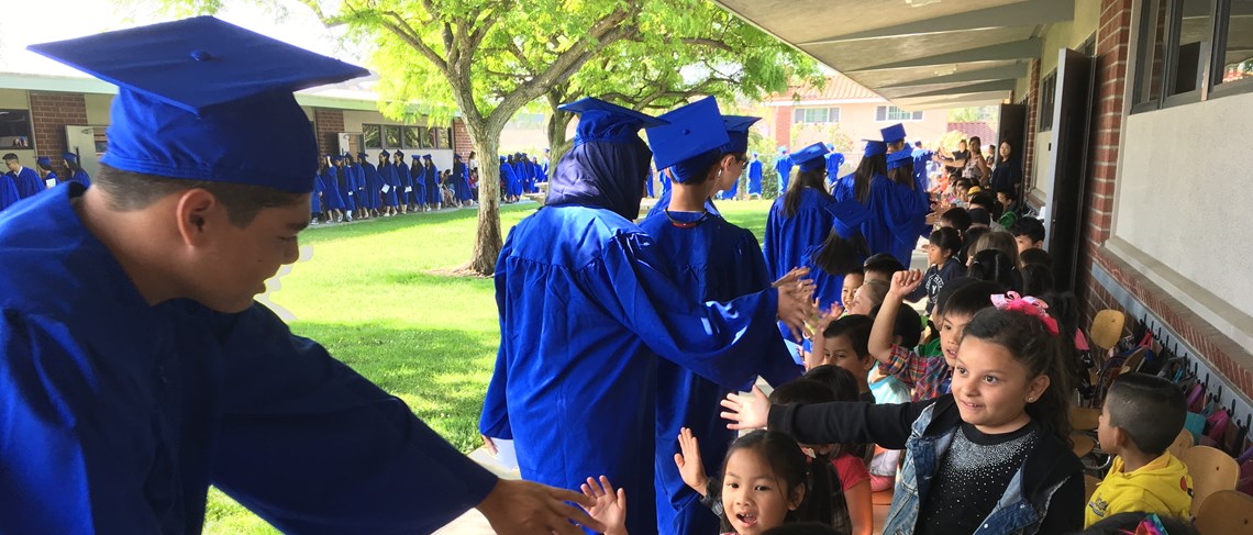 Throughout the hallways and across the campus of Thomas Paine Elementary School, La Quinta High School  graduates make a positive impact on Paine students